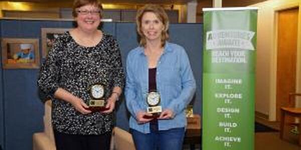 two ladies with awards